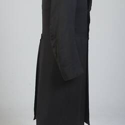 Gentleman's black cotton frock coat, profile.