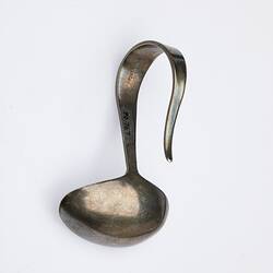 Back view of silver spoon with u-shaped handle. Hallmarked.