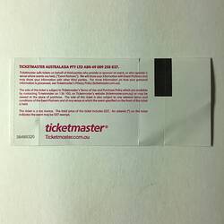 Back of white ticket with red printed text.