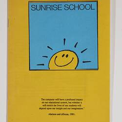 Yellow booklet cover with blue square featuring yellow smiling 'sunshine' face. Black printed text above/below