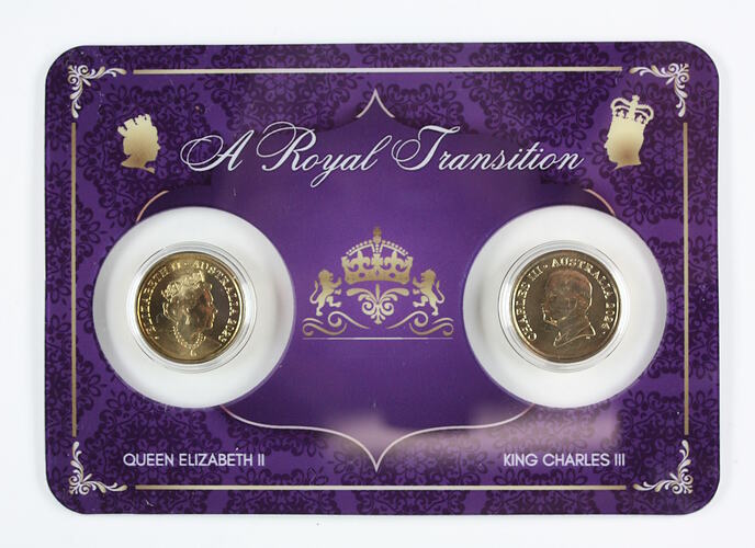 Purple coloured plastic card with two gold coins in clear plasxtic windows.