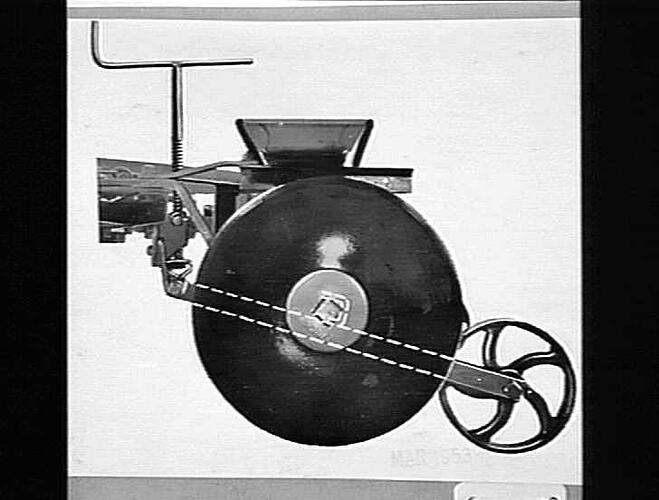 Photograph detailing chain driven stabilization wheel.