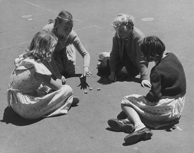 Playing Jacks in Government school playground, Melbourne, 1955.