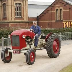 Volunteer driving Chamberlain Prototype Light Tractor at Machinery in Action Show