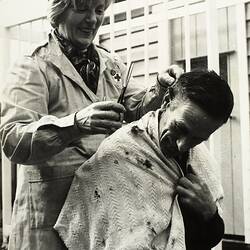 Woman Giving Man Hair Cut, Backyard, Ivanhoe, 1968