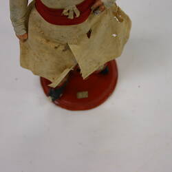 clay and fabric figurine, bottom half.