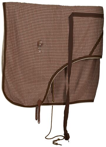 Rectangular woollen horse rug, brown and white check. Brown fastenings and leather straps.