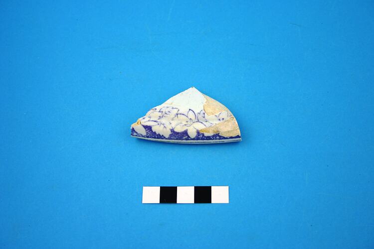 Fragment of pot with violet transfer print.