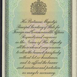 Coloured page with decorative white printed frame. Printed coat of arms and text.