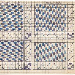 Sheet with black and blue square gridded pattern. Crosses marked in square divides the pattern into four sections.