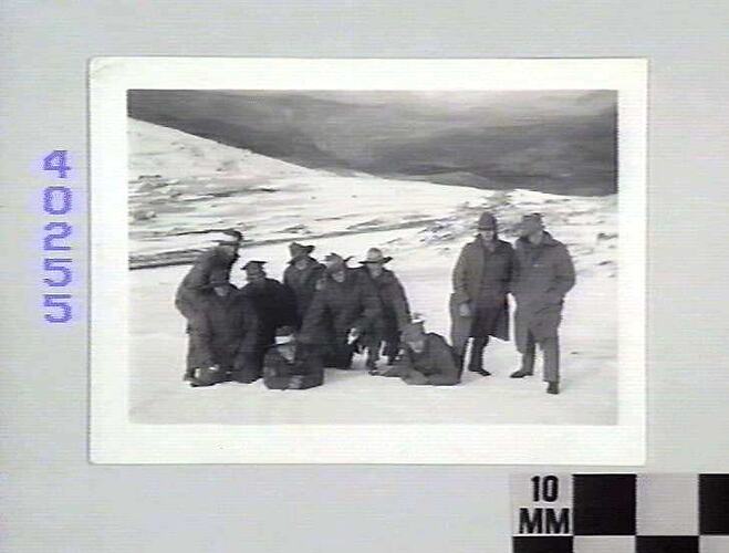 Group of men in snow.