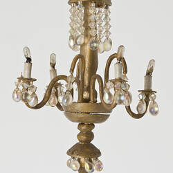 Gold coloured chandelier with crystal style beads.