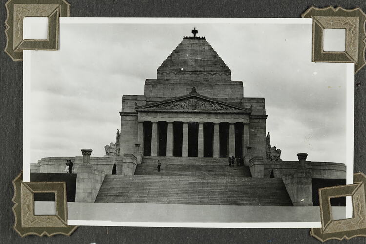 Stone monument building with portico and stairs in front.