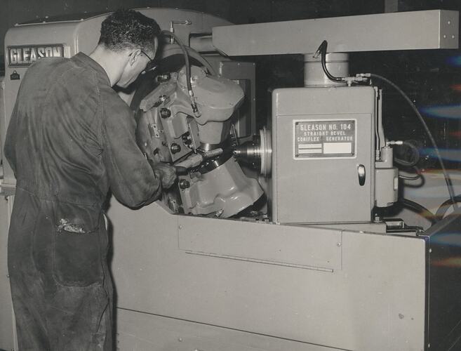 A man is operating a machine.