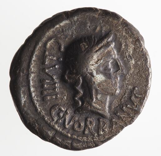 Round coin, aged, female profile, facing right, wearing headdress.