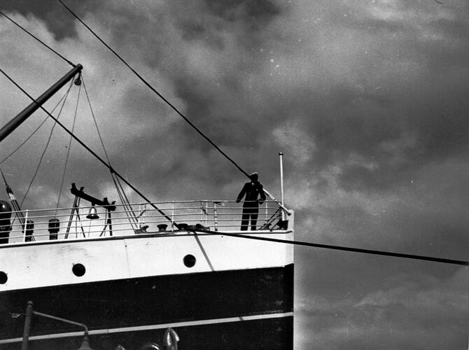 [Captain Smith casting off the bow rope, about 1930s.]