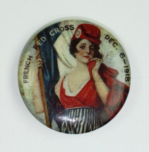 Badge with woman wearing red holding flag.