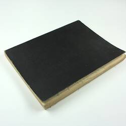 Closed book with black cover.