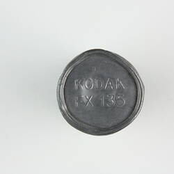 Embossed metal seal on film canister.