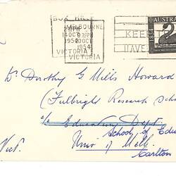 Addressed, stamped envelope with handwritten annotations in blue ink on front