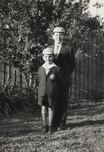 Two children in matching school uniforms