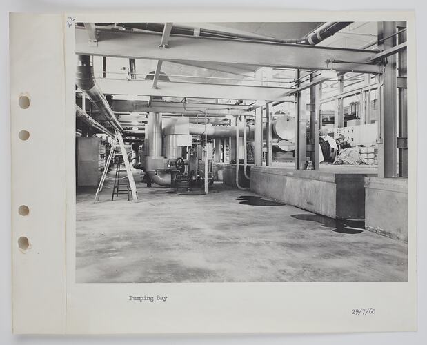 Industrial interior showing pumps and machinery.