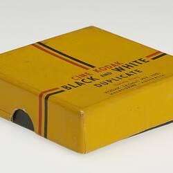 Cardboard box with black base and yellow lid.