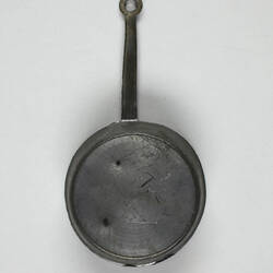 Back of toy frying pan.