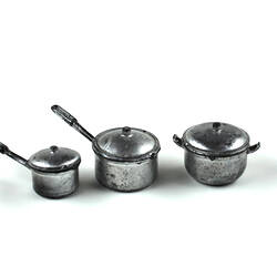 Three toy silver pots.