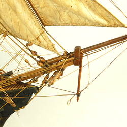 Wooden ship with three masts, detail of bow.