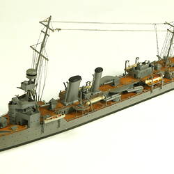 Naval ship with mast, three quarter view.