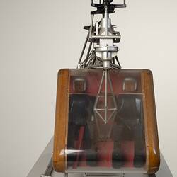 Model of a twin-rotor helicopter. Front view shows two occupants.