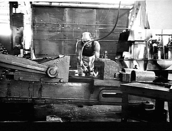 PICTURES FROM CONCORD WEST - JOE CARROLL OPERATES AN IRON-BENDING MACHINE AT THE CONCORD WEST FACTORY, AND, LIKE OTHER NEW EMPLOYEES AT THE FACTORY IS WELCOMED TO THE SUNSHINE ORGANISATION. (THIS MACHINE COMMONLY KNOWN AS A `BULLDOZER'): `SUNSHINE REVIEW'