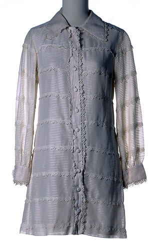 Long-sleeved mini shirt-dress, cream cotton, lace.