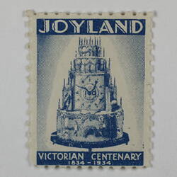 Rectangular stamp with image of a tiered cake in blue ink.