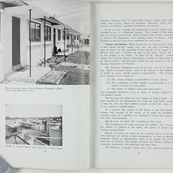 Open booklet with white pages and black printing. Houses on left page.