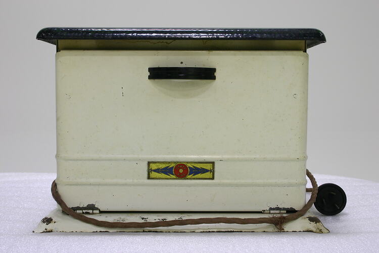 Side view of white portable stove.