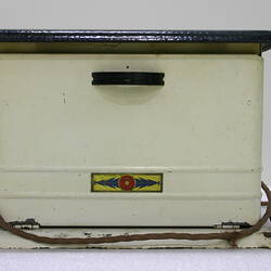 Side view of white portable stove.
