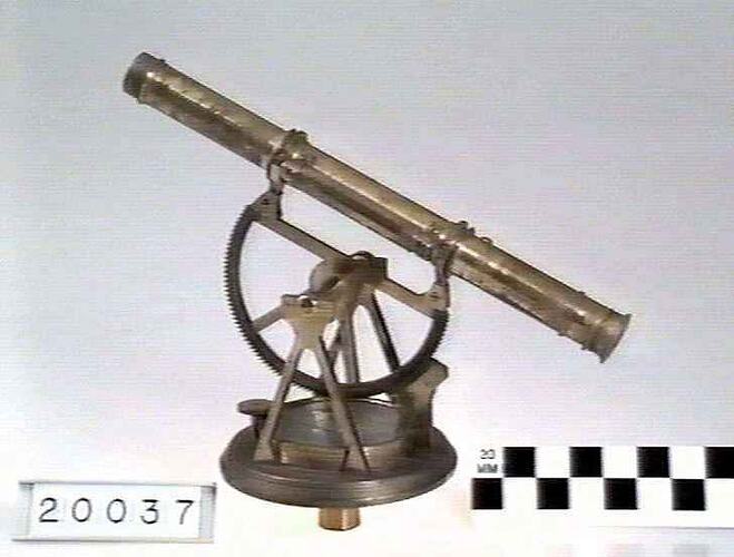 Brass circular base with glass face over dial.