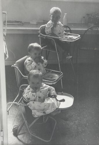 Digital Photograph - Three Babies in High Chairs in Kitchen, Doncaster East, 1962