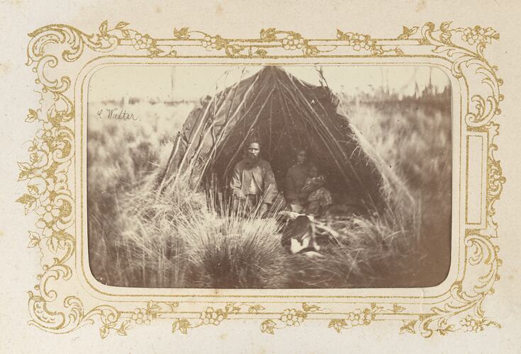 Family sitting inside a shelter, Victoria, circa 1872