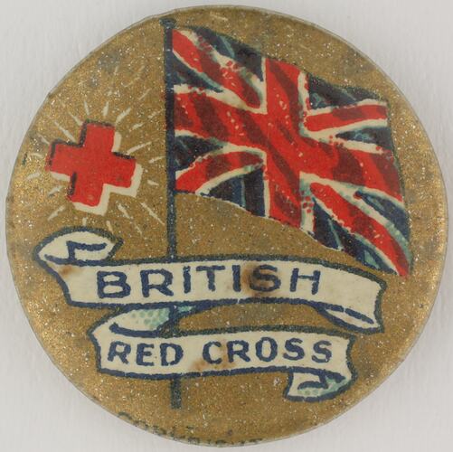Round  badge with British flag and red cross.