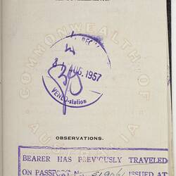 White passport page with black printed text and blue handwritten text. Two purple stamps.