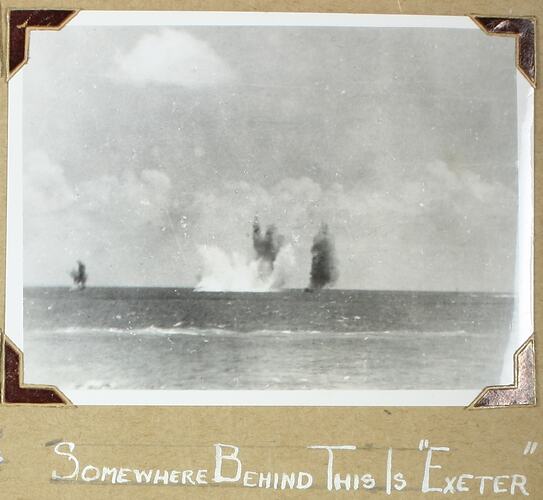 Multiple explosions in the water in background, ocean in is the foreground.