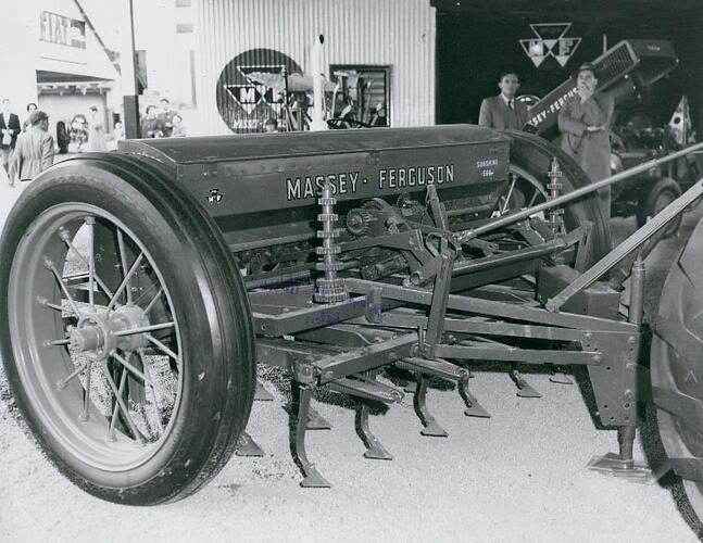 A seed and fertilzer drill on display at an agricultural show.