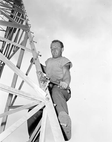 [Tightening bolts on an electricity pylon, Terang, about 1940s.]