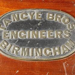 Manufacturers' plate on top of wooden box.