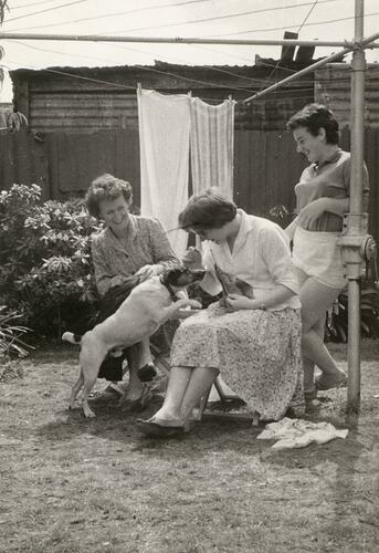 Dorothea Dunzinger with Friends & Dog in Garden, 1956