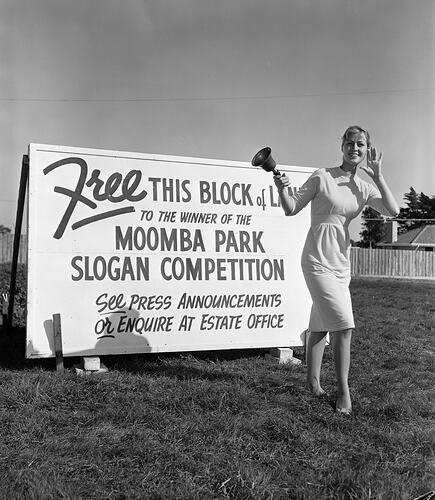 Moomba Estate, Woman with Advertising Billboard, Victoria, 11 Apr 1959