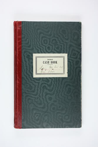 Leatherbound accounting ledger with printed label.